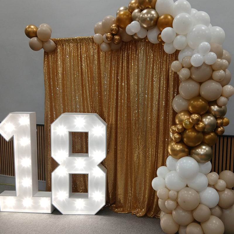 Gold Drapes Backdrop, balloon garland with Light Up Numbers