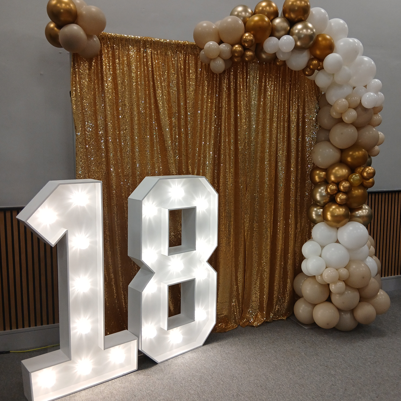 Gold Drapes Backdrop, balloon garland with Light Up Numbers